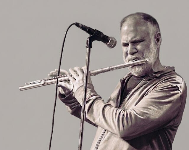 Mark playing flute